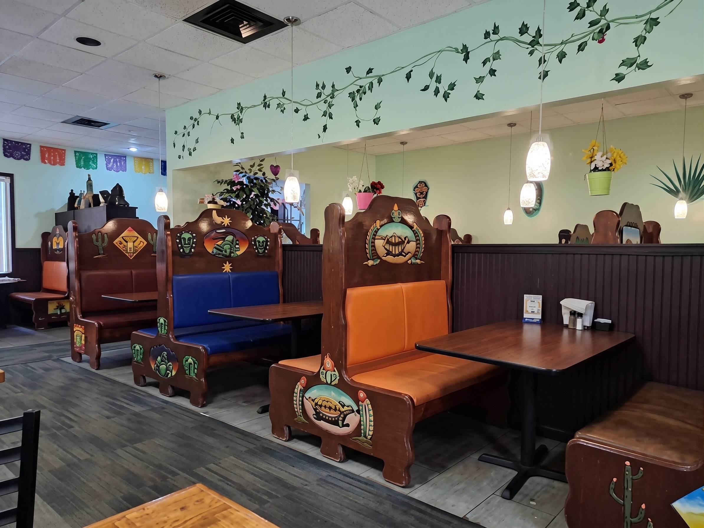 The hand-painted booths in the dining room