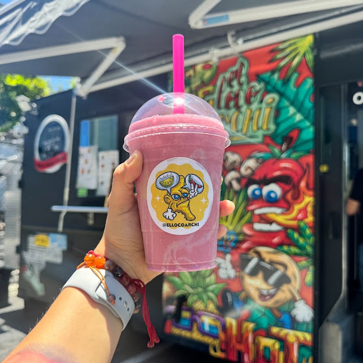 A fruit smoothie in front of the truck